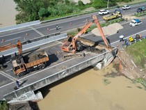 1764651921274-perbaikan-jalan-tol-kualanamu-arah-medan-yang-amblas-akibat-curah-hujan-tinggi-1764415429962_43